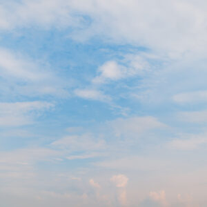 Blue sky surrounded by subtle clouds