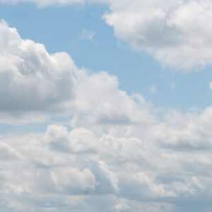 Fluffy soft clouds on a light blue sky