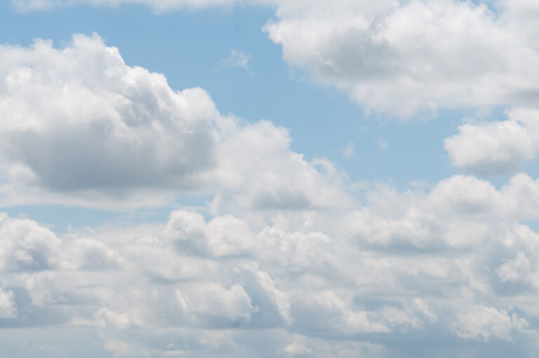 Fluffy soft clouds on a light blue sky