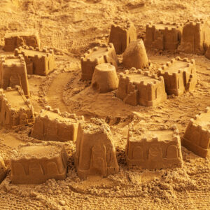 Sandcastles playground castle buckets full frame sand back
