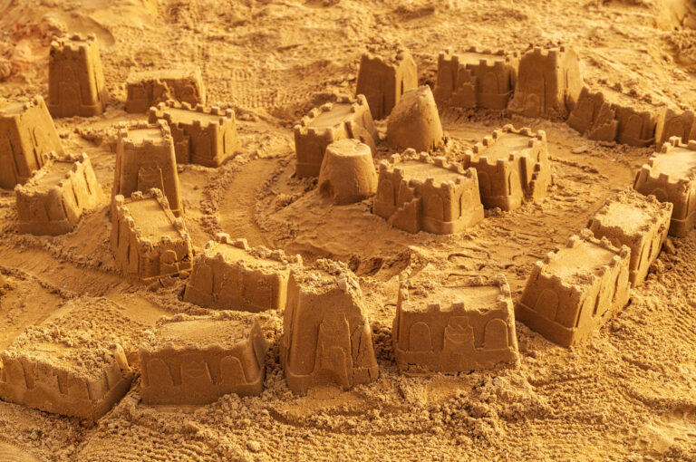 Sandcastles playground castle buckets full frame sand back