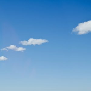 Three Low Hanging Little White Clouds